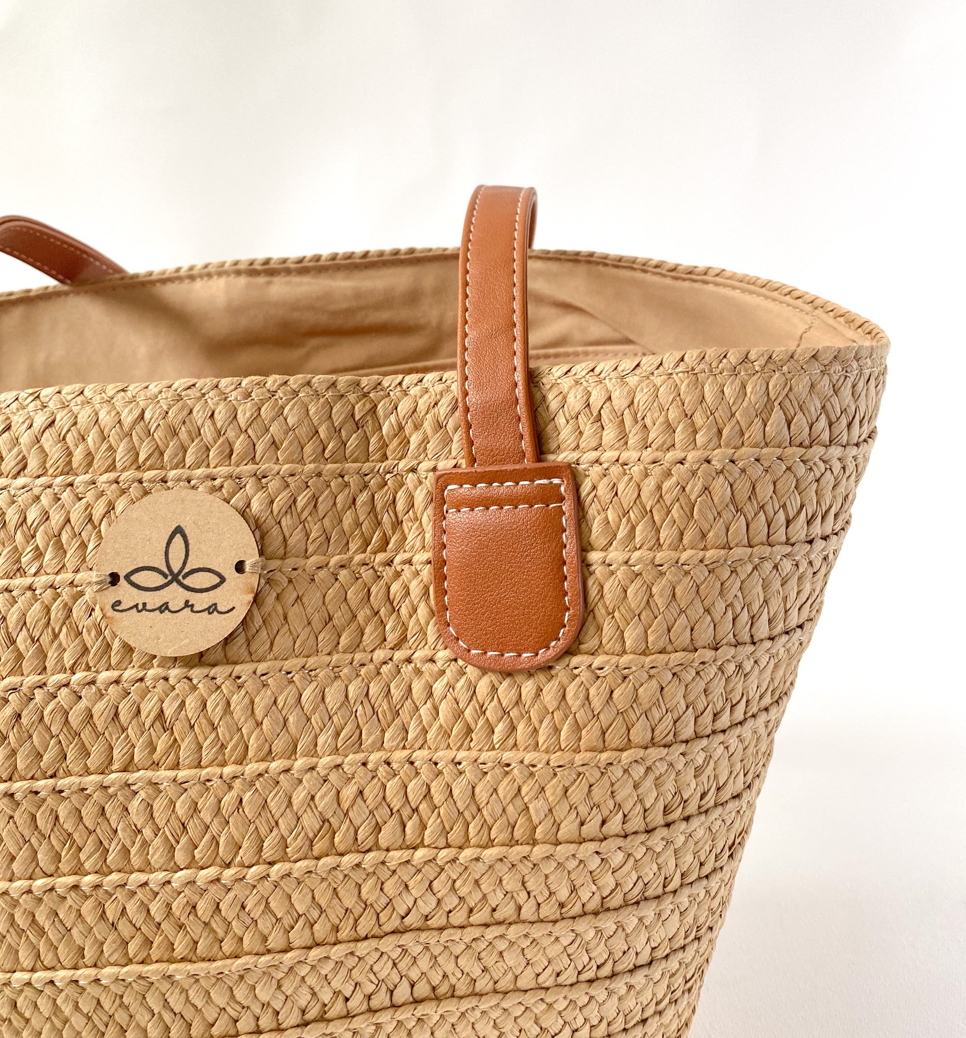 Evara’s premium handcrafted handbag made from 100% natural banana fiber, showcasing a sustainable woven texture, structured silhouette, and minimalist eco-conscious design. Features include a durable zip closure, reinforced handles, soft cotton lining, and a spacious interior—perfect for everyday use, work, or travel. Lightweight, biodegradable, and stylish, it’s an ideal accessory for conscious consumers embracing slow fashion.