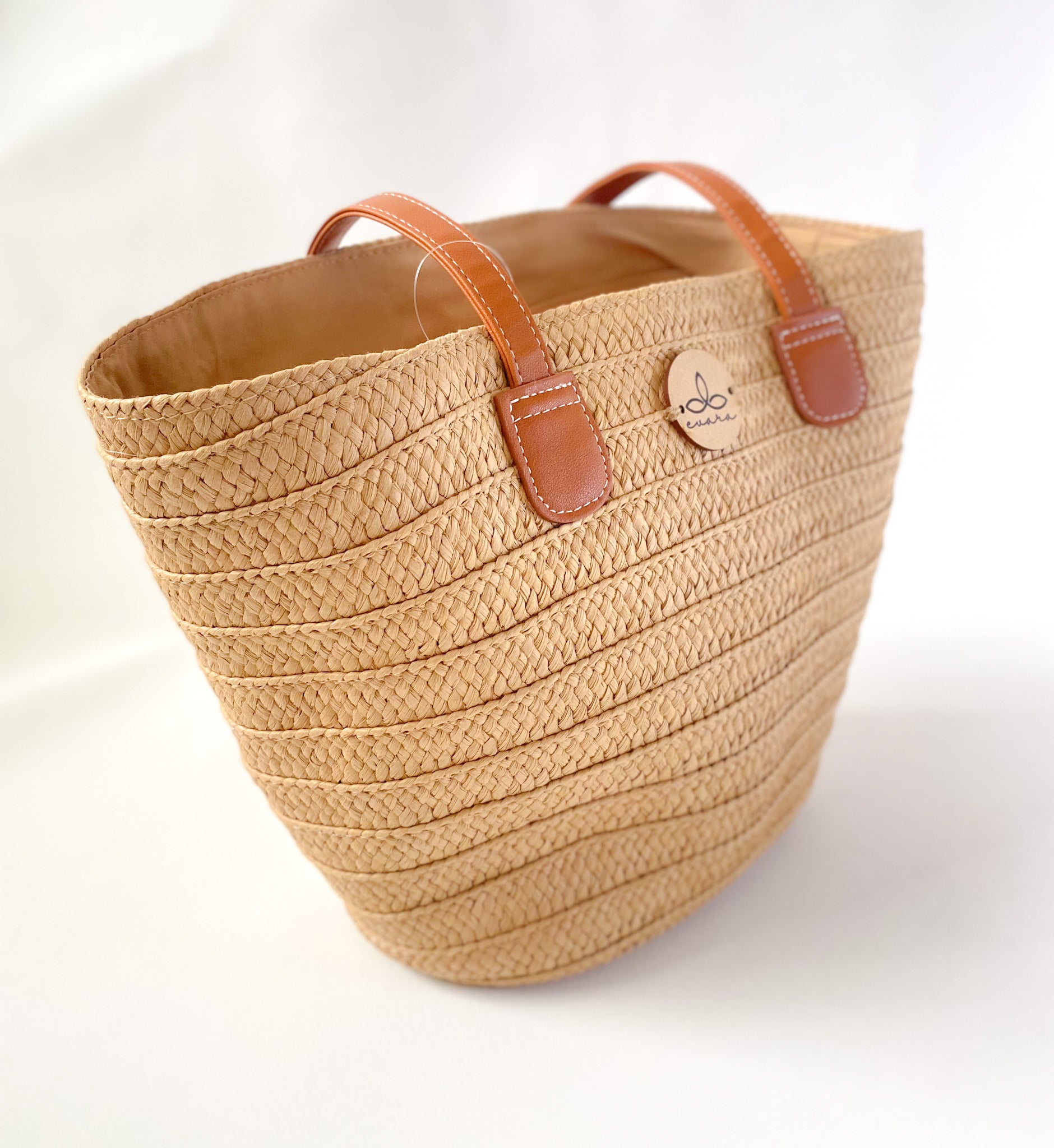 Evara’s premium handcrafted handbag made from 100% natural banana fiber, showcasing a sustainable woven texture, structured silhouette, and minimalist eco-conscious design. Features include a durable zip closure, reinforced handles, soft cotton lining, and a spacious interior—perfect for everyday use, work, or travel. Lightweight, biodegradable, and stylish, it’s an ideal accessory for conscious consumers embracing slow fashion.
