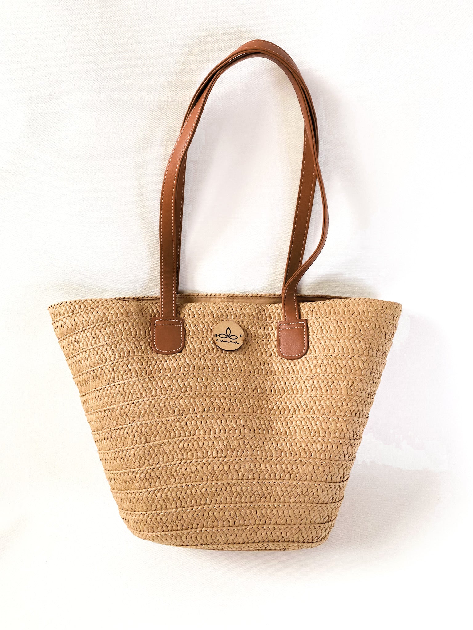 Evara’s premium handcrafted handbag made from 100% natural banana fiber, showcasing a sustainable woven texture, structured silhouette, and minimalist eco-conscious design. Features include a durable zip closure, reinforced handles, soft cotton lining, and a spacious interior—perfect for everyday use, work, or travel. Lightweight, biodegradable, and stylish, it’s an ideal accessory for conscious consumers embracing slow fashion.