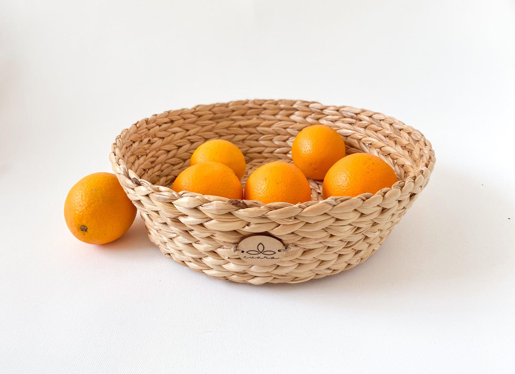Evara’s artisanal storage basket handcrafted from 100% natural banana fiber, designed with a sturdy woven structure, minimalist aesthetic, and smooth natural finish. Ideal for organizing living spaces, storing linens, toys, or accessories. Lightweight yet durable, with reinforced edges and optional handles for easy mobility. A biodegradable, eco-friendly home décor piece that blends functionality with timeless elegance.
