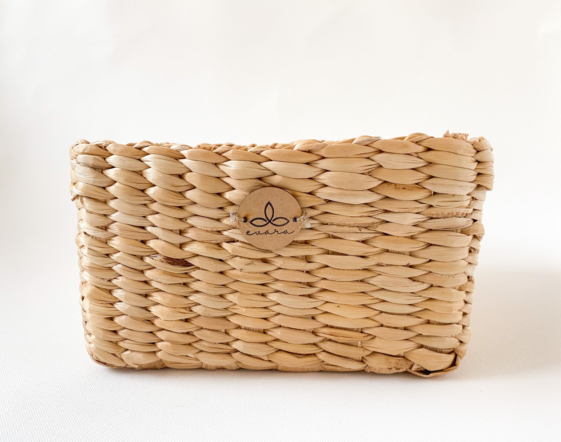 Evara’s artisanal storage basket handcrafted from 100% natural banana fiber, designed with a sturdy woven structure, minimalist aesthetic, and smooth natural finish. Ideal for organizing living spaces, storing linens, toys, or accessories. Lightweight yet durable, with reinforced edges and optional handles for easy mobility. A biodegradable, eco-friendly home décor piece that blends functionality with timeless elegance.