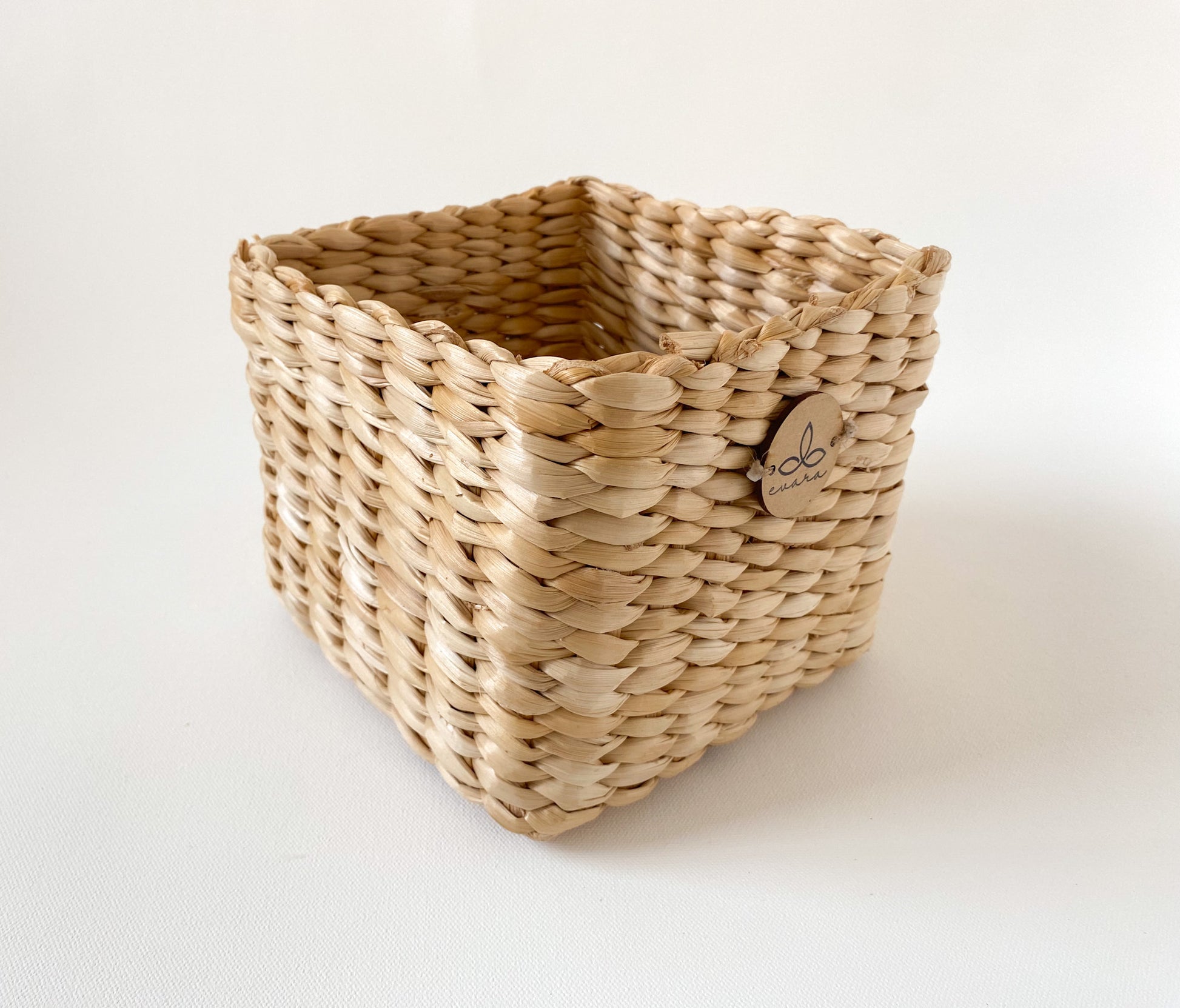 Evara’s artisanal storage basket handcrafted from 100% natural banana fiber, designed with a sturdy woven structure, minimalist aesthetic, and smooth natural finish. Ideal for organizing living spaces, storing linens, toys, or accessories. Lightweight yet durable, with reinforced edges and optional handles for easy mobility. A biodegradable, eco-friendly home décor piece that blends functionality with timeless elegance.