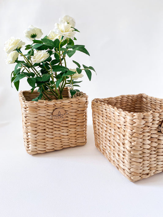 Evara’s artisanal storage basket handcrafted from 100% natural banana fiber, designed with a sturdy woven structure, minimalist aesthetic, and smooth natural finish. Ideal for organizing living spaces, storing linens, toys, or accessories. Lightweight yet durable, with reinforced edges and optional handles for easy mobility. A biodegradable, eco-friendly home décor piece that blends functionality with timeless elegance.