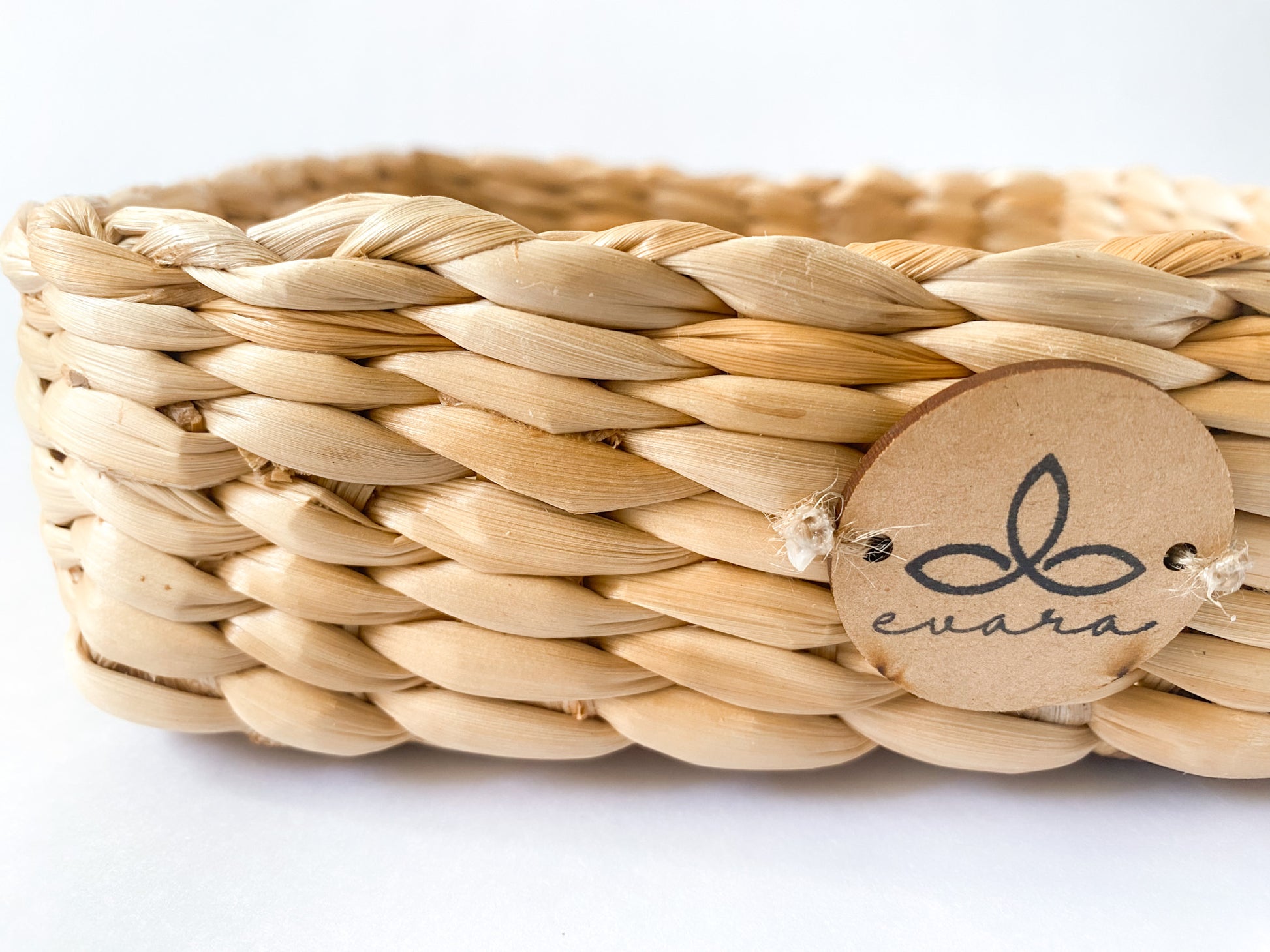 Evara’s artisanal storage basket handcrafted from 100% natural banana fiber, designed with a sturdy woven structure, minimalist aesthetic, and smooth natural finish. Ideal for organizing living spaces, storing linens, toys, or accessories. Lightweight yet durable, with reinforced edges and optional handles for easy mobility. A biodegradable, eco-friendly home décor piece that blends functionality with timeless elegance.
