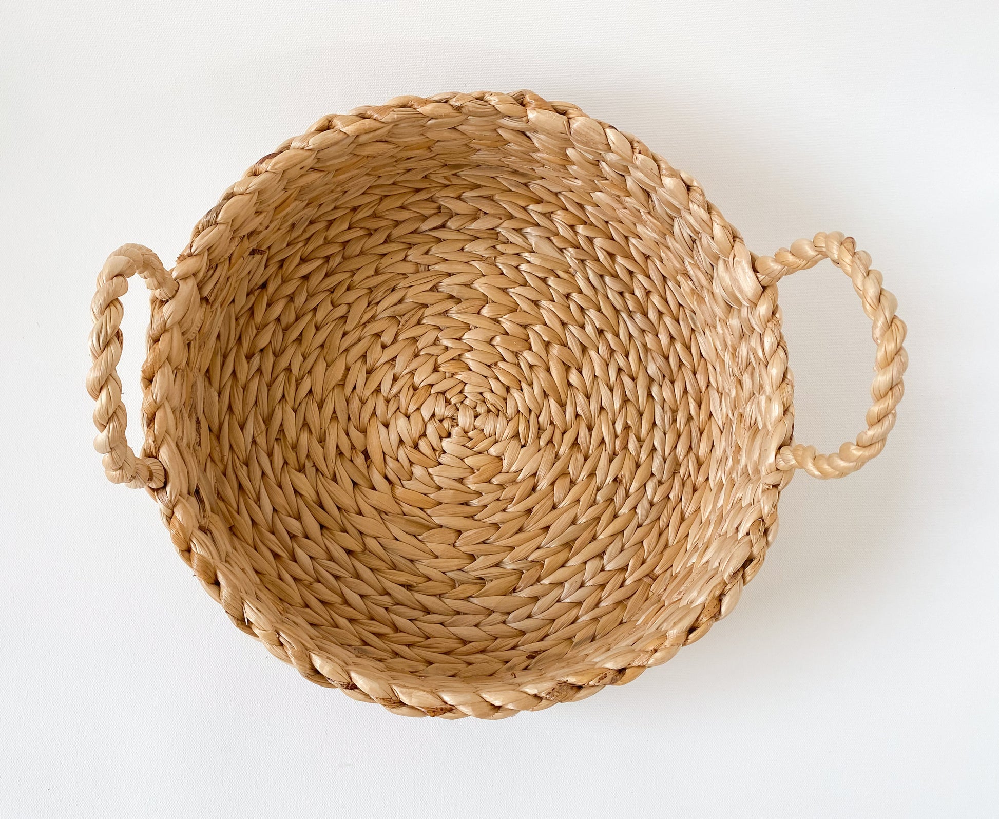 Evara’s artisanal storage basket handcrafted from 100% natural banana fiber, designed with a sturdy woven structure, minimalist aesthetic, and smooth natural finish. Ideal for organizing living spaces, storing linens, toys, or accessories. Lightweight yet durable, with reinforced edges and optional handles for easy mobility. A biodegradable, eco-friendly home décor piece that blends functionality with timeless elegance.