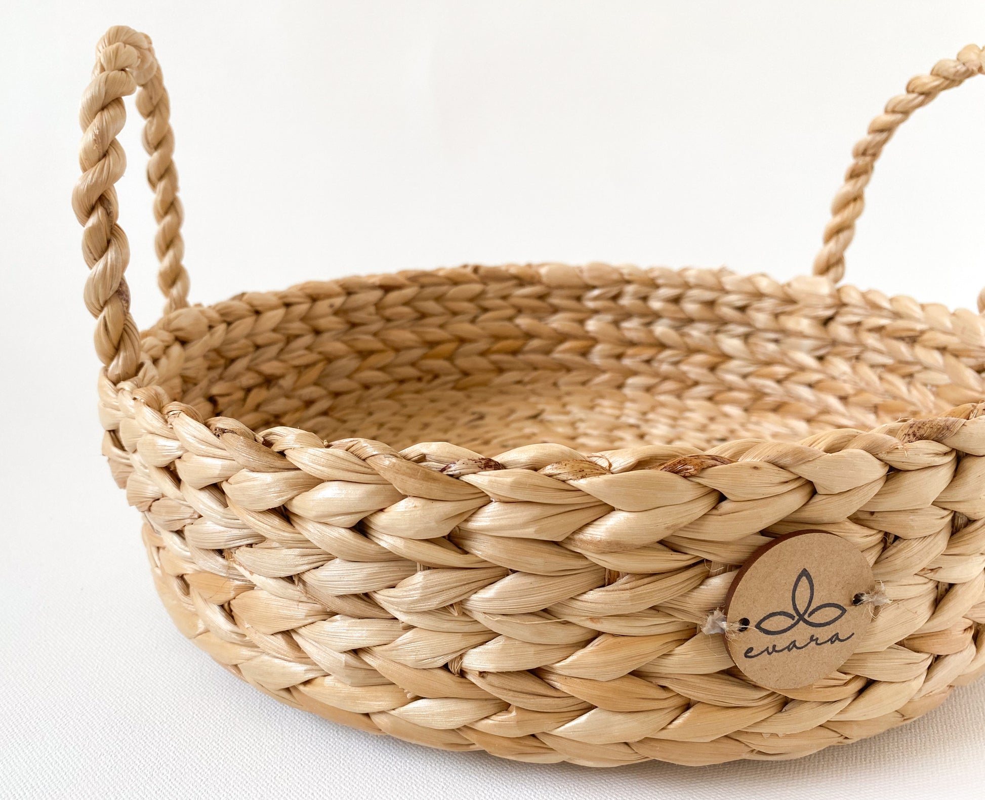 Evara’s artisanal storage basket handcrafted from 100% natural banana fiber, designed with a sturdy woven structure, minimalist aesthetic, and smooth natural finish. Ideal for organizing living spaces, storing linens, toys, or accessories. Lightweight yet durable, with reinforced edges and optional handles for easy mobility. A biodegradable, eco-friendly home décor piece that blends functionality with timeless elegance.