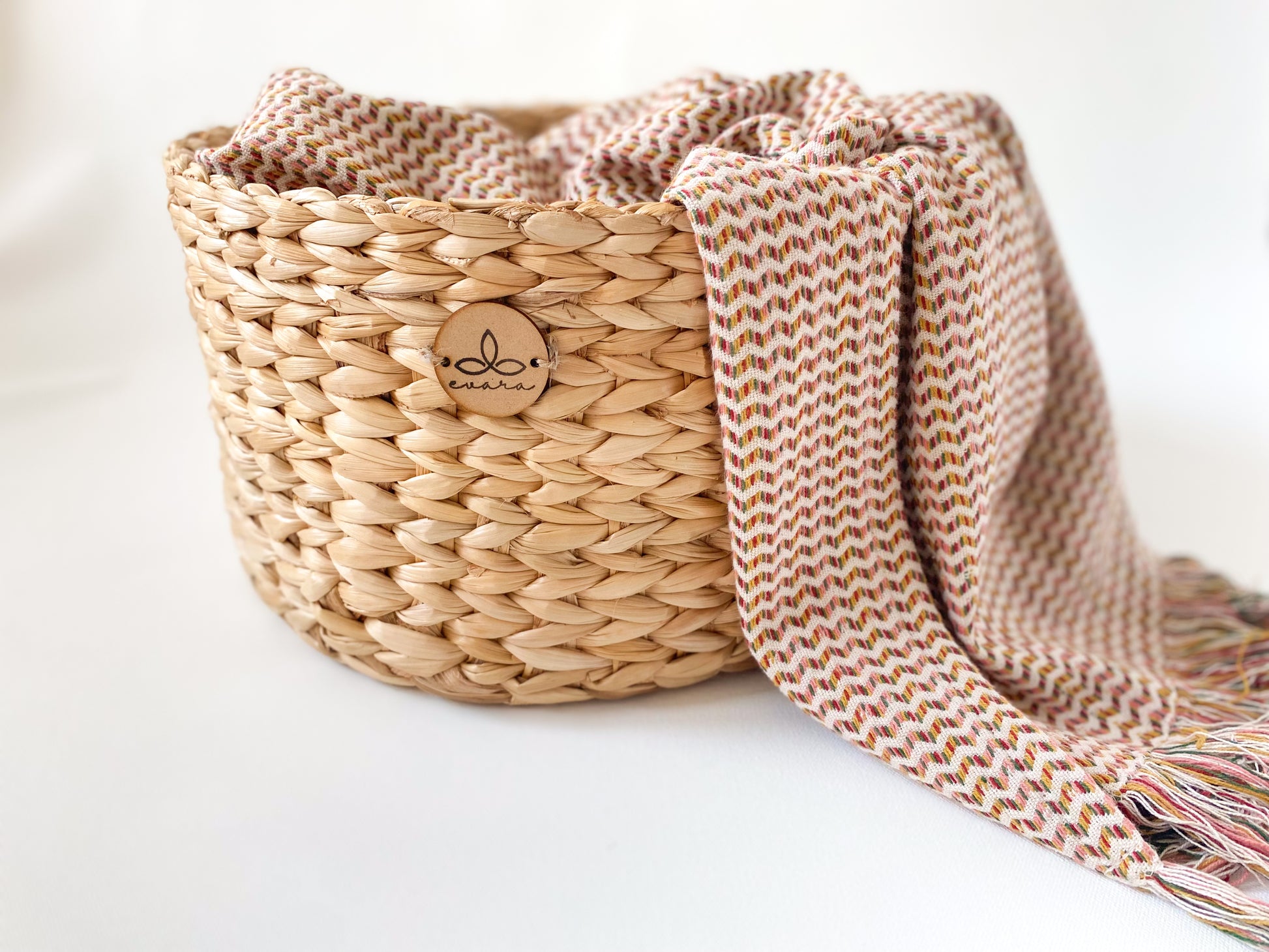 Evara’s artisanal storage basket handcrafted from 100% natural banana fiber, designed with a sturdy woven structure, minimalist aesthetic, and smooth natural finish. Ideal for organizing living spaces, storing linens, toys, or accessories. Lightweight yet durable, with reinforced edges and optional handles for easy mobility. A biodegradable, eco-friendly home décor piece that blends functionality with timeless elegance.
