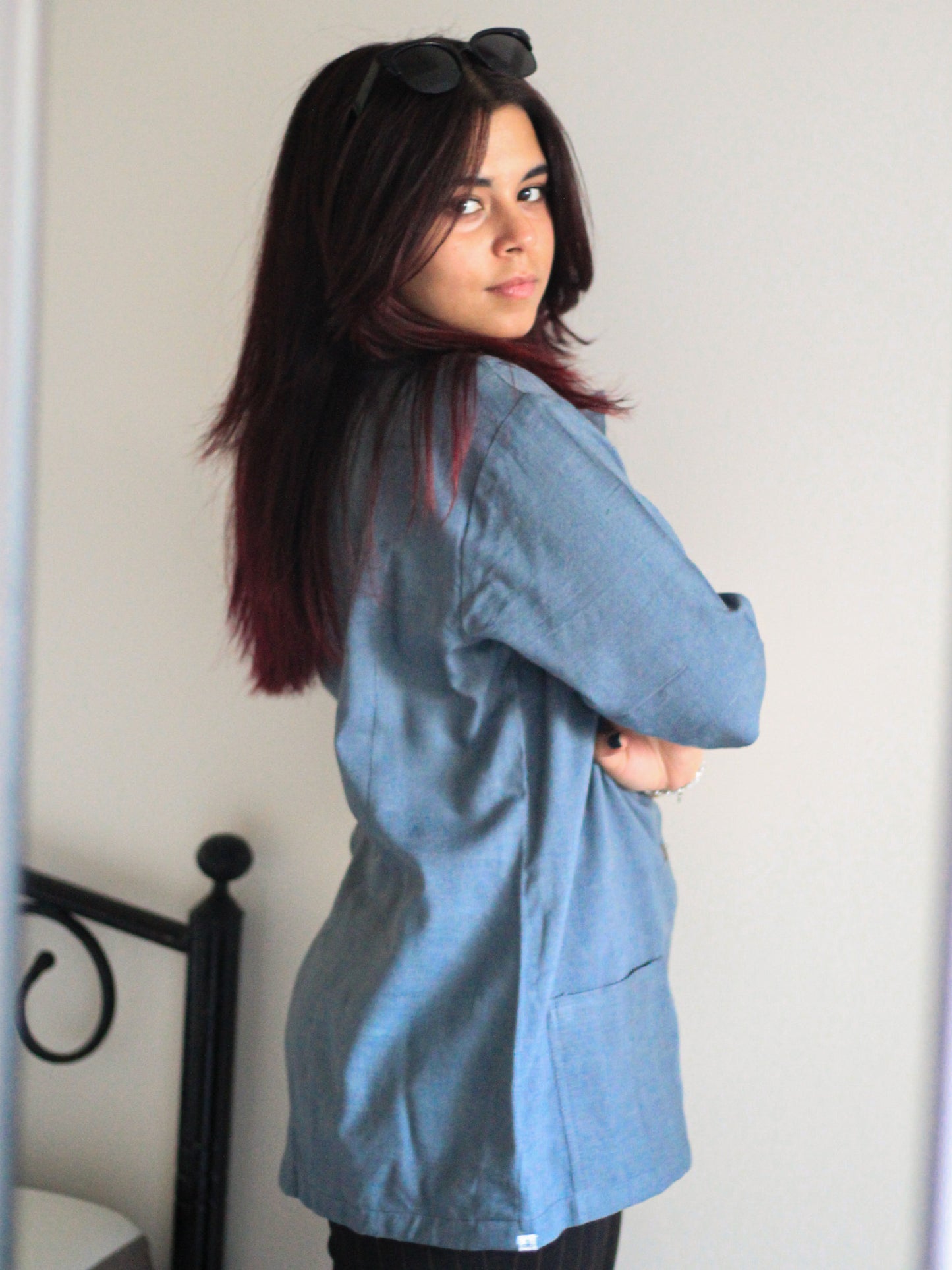 Model wearing Evara’s Moonlit Bay Half-Sleeve Button-Down Shirt, made from a sustainable blend of banana fiber and cotton. This lightweight, breathable shirt features a structured silhouette, soft texture, and natural sheen, offering all-day comfort with moisture-wicking properties. A versatile wardrobe staple, ideal for casual and smart-casual looks. Shop eco-friendly fashion at Evara.